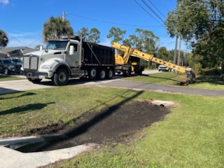 Crew from Road & Bridge working along Old Mission Road in New Smyrna Beach